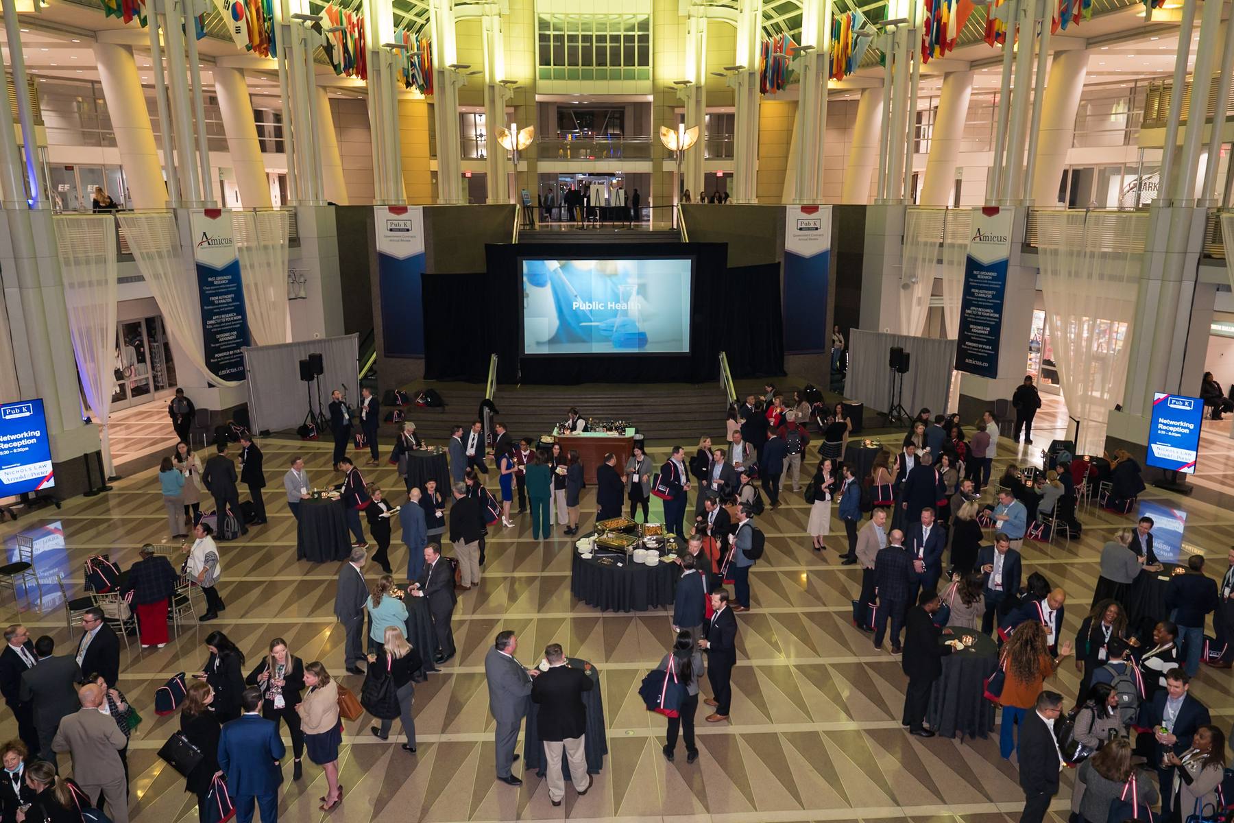 Annual Review attendees gathering in the venue atrium